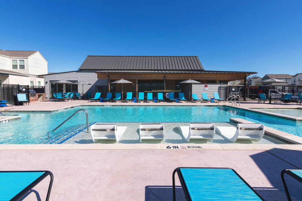 Swimming pool with a sundeck at Elevate at Skyline in McKinney, Texas