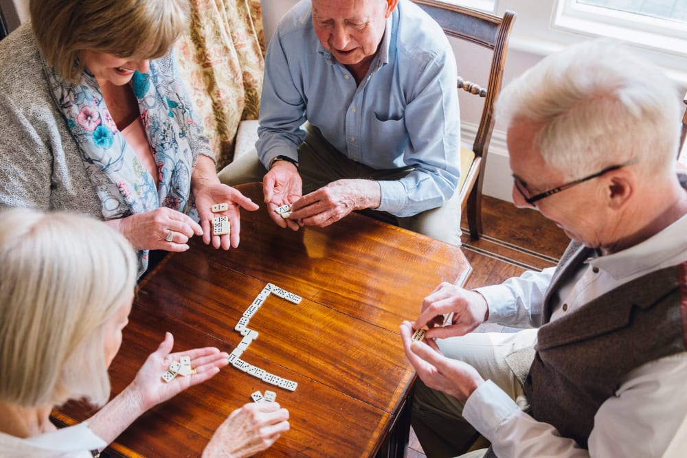 Residents playing dominos at English Meadows Crozet Campus in Crozet, Virginia
