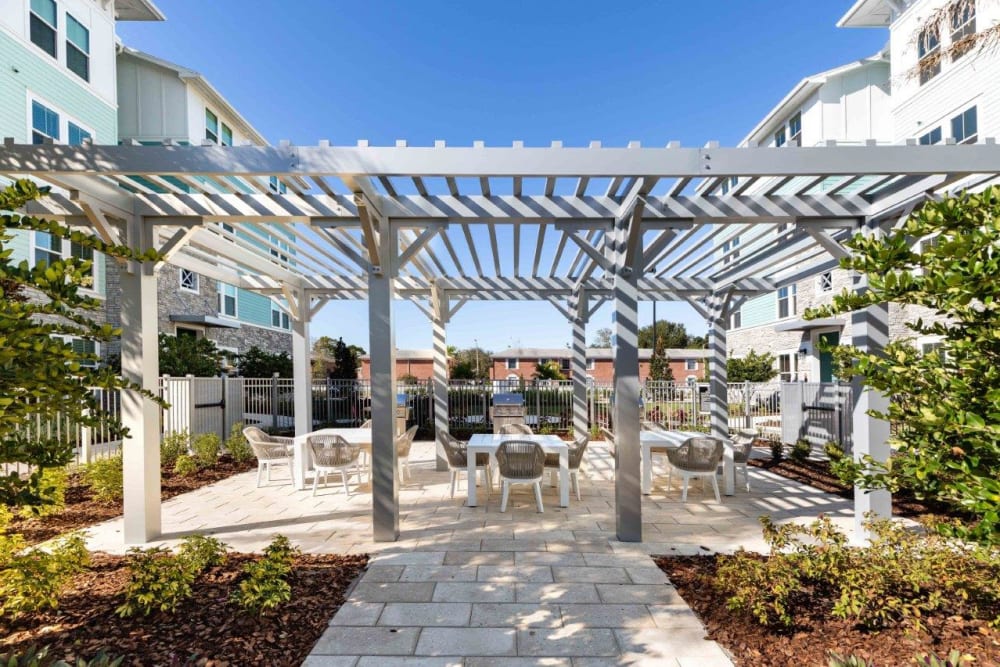 Outdoor courtyard area by the pool at The Addison Skyway Marina in St. Petersburg, Florida