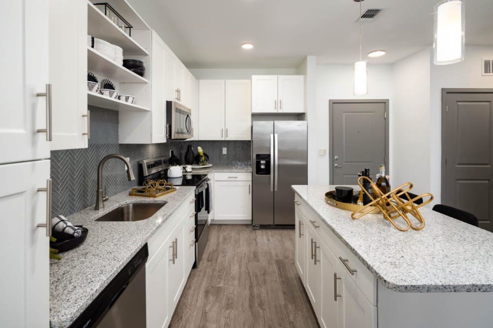 Spacious kitchen with large island at The Addison Skyway Marina in St. Petersburg, Florida
