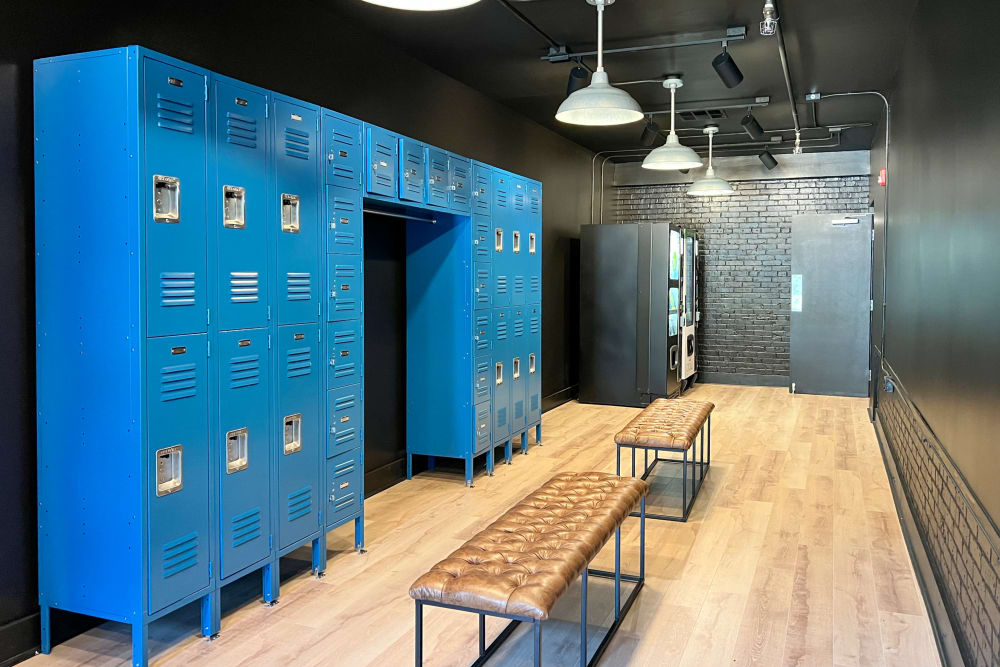  Clubhouse locker room with blue metal lockers at Lofts at Riverwalk in Columbus, Georgia