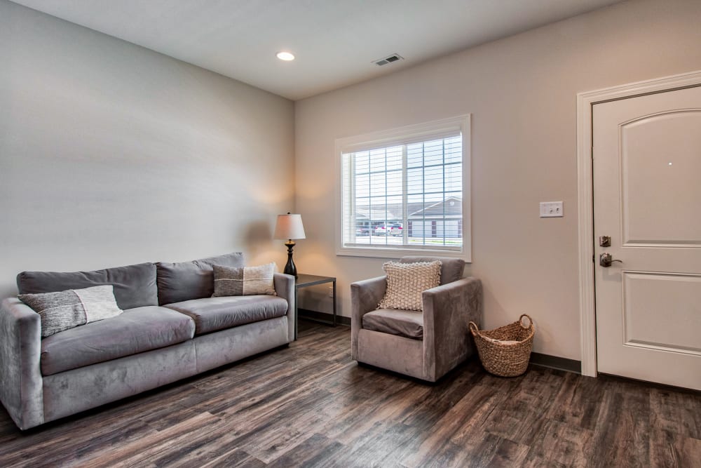 Living room with wood flooring at Retreat at Leisure Living in Evansville, Indiana