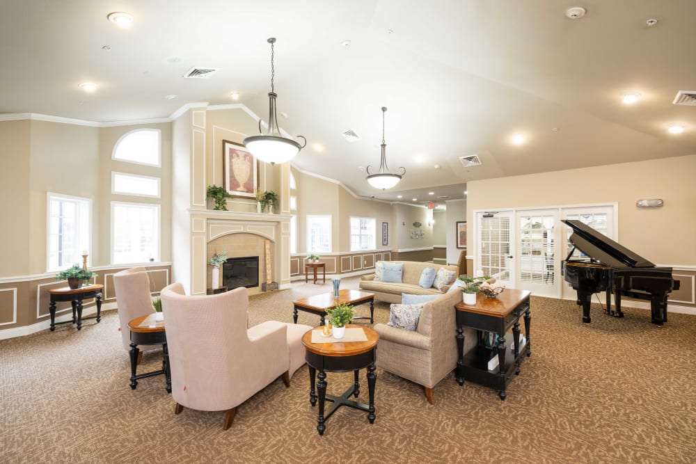 Lounge seating and piano at The Heritage Memory Care in The Woodlands, Texas