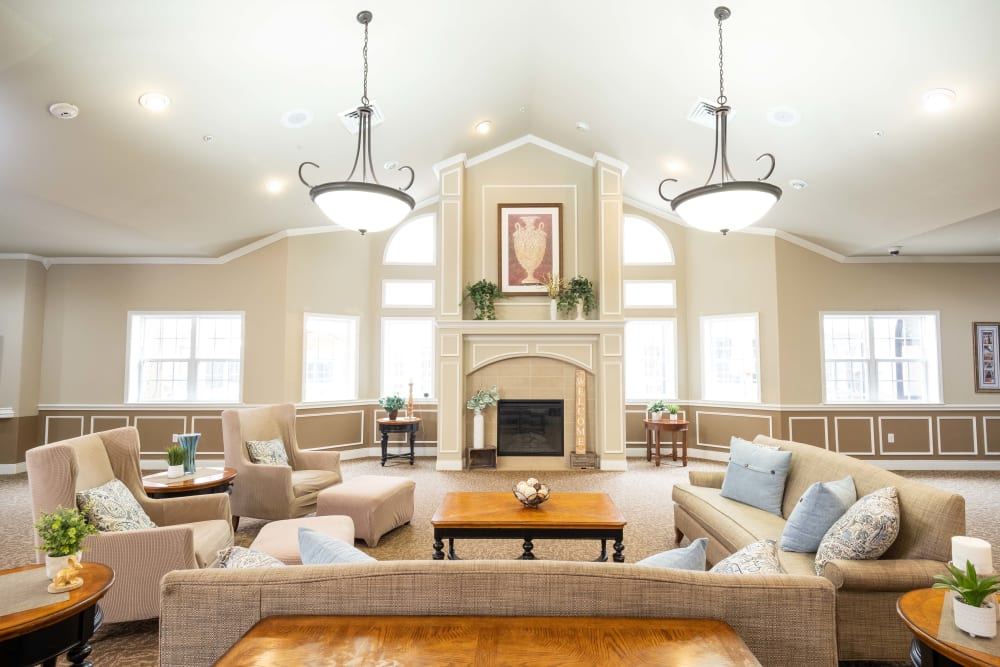 Comfortable lounge and fireplace at The Heritage Memory Care in The Woodlands, Texas