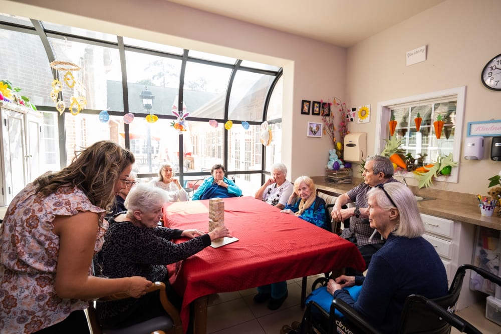 Residents playing Jenga at The Heritage Memory Care in The Woodlands, Texas