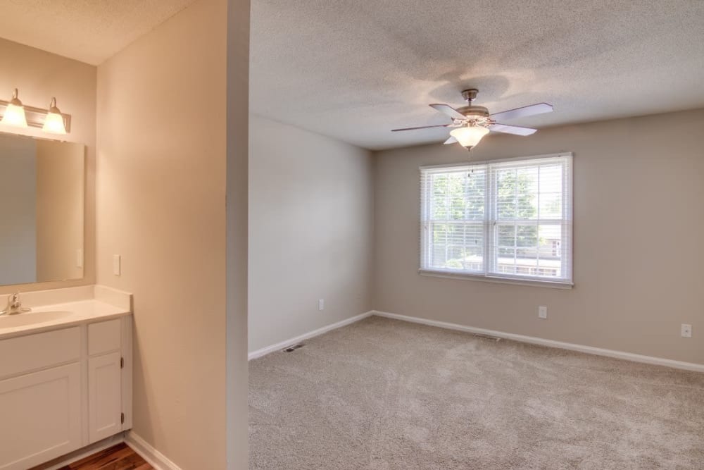 Master bedroom with a bathroom at Foundry Townhomes in Simpsonville, South Carolina