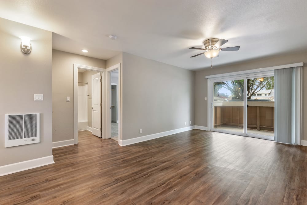 Living Room with Hard-Wood Style Flooring at Pentagon Apartment Homes Fremont, California.