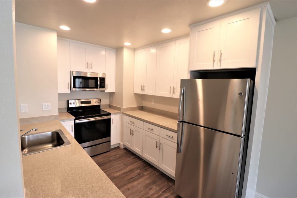 Luxury kitchen with stainless steel appliances at  Marina Haven Apartment Homes in San Leandro, California