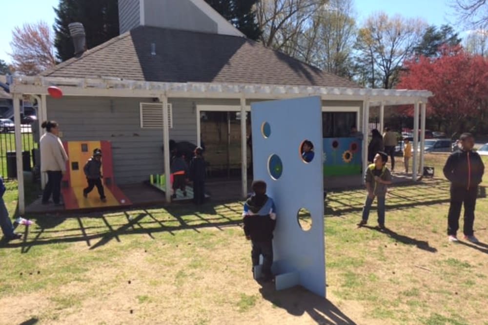 Residents playing a yard game at Devonwood Apartment Homes in Charlotte, North Carolina