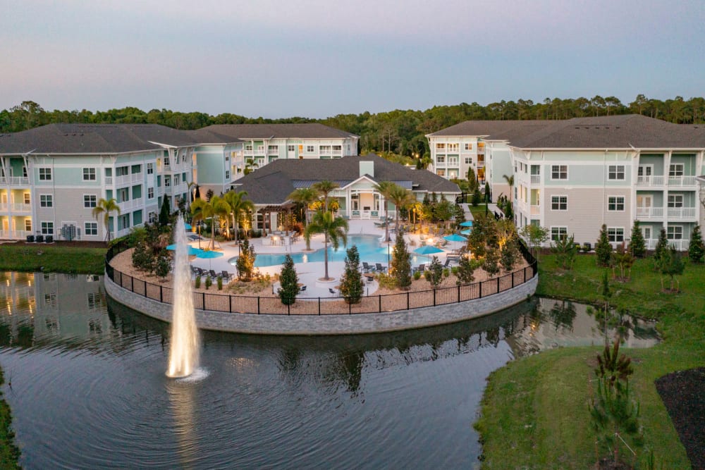 One BR Apartments in Lutz FL - Sage at Cypress - Birdseye View of Pool with Nearby Lake and Fountain