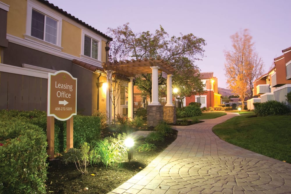 Pathways throughout the community at dusk at Peppertree Apartment Homes in San Jose, California