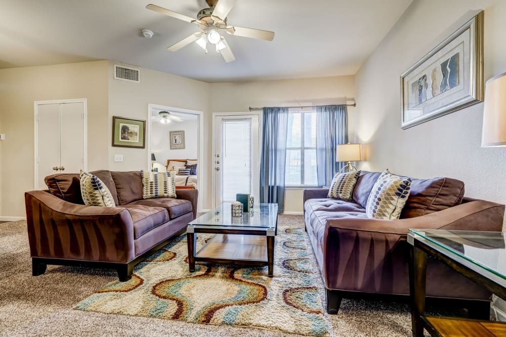 Model living room at Legacy of Cedar Hill Apartments & Townhomes in Cedar Hill, Texas.