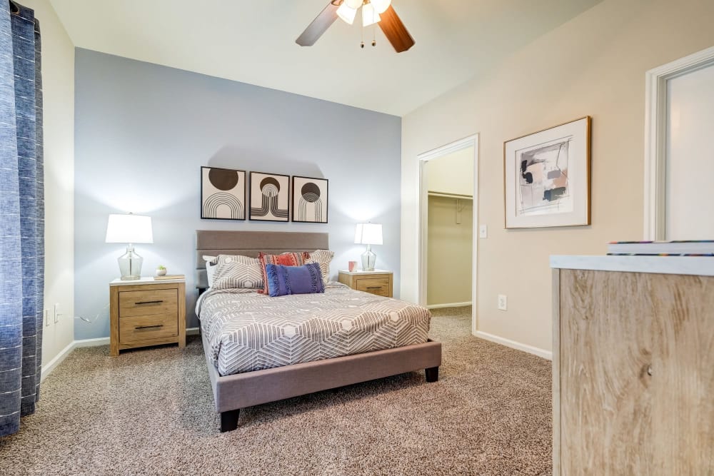 Luxurious and spacious bedroom with access to natural lighting at Legacy of Cedar Hill Apartments & Townhomes in Cedar Hill, Texas