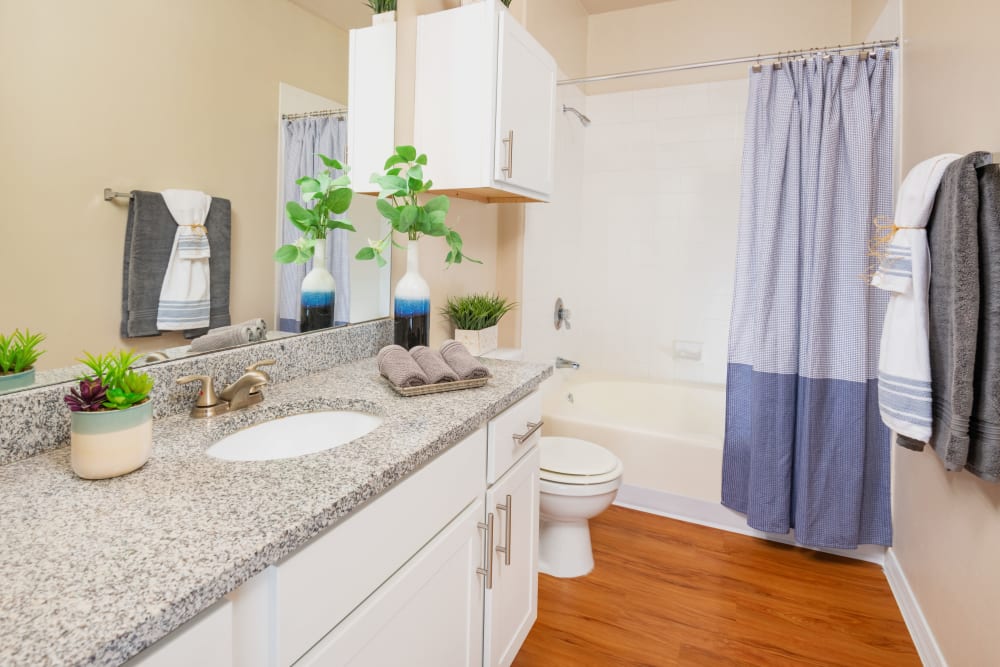 Bathroom with shower and sink at Villas on Hampton Avenue