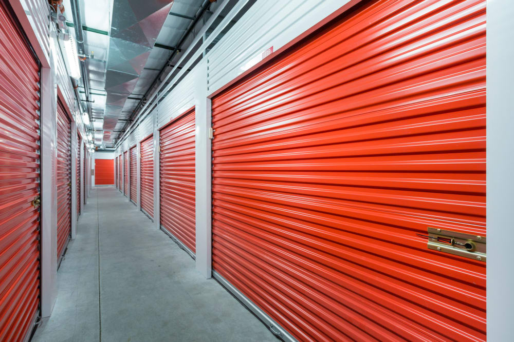 orange doors of indoor units at Trojan Storage of North Sacramento in Sacramento, California