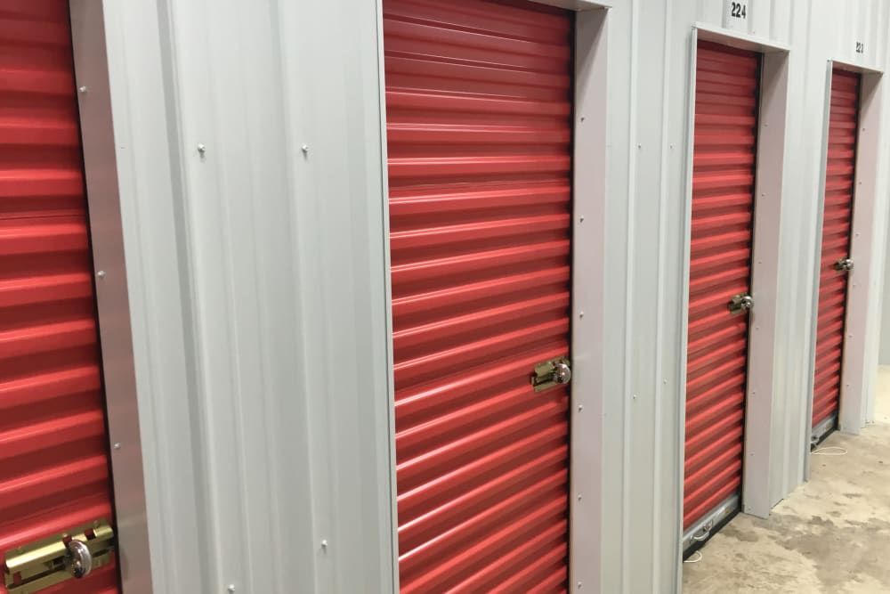 orange doors of indoor units at Trojan Storage of Woodinville in Woodinville, Washington