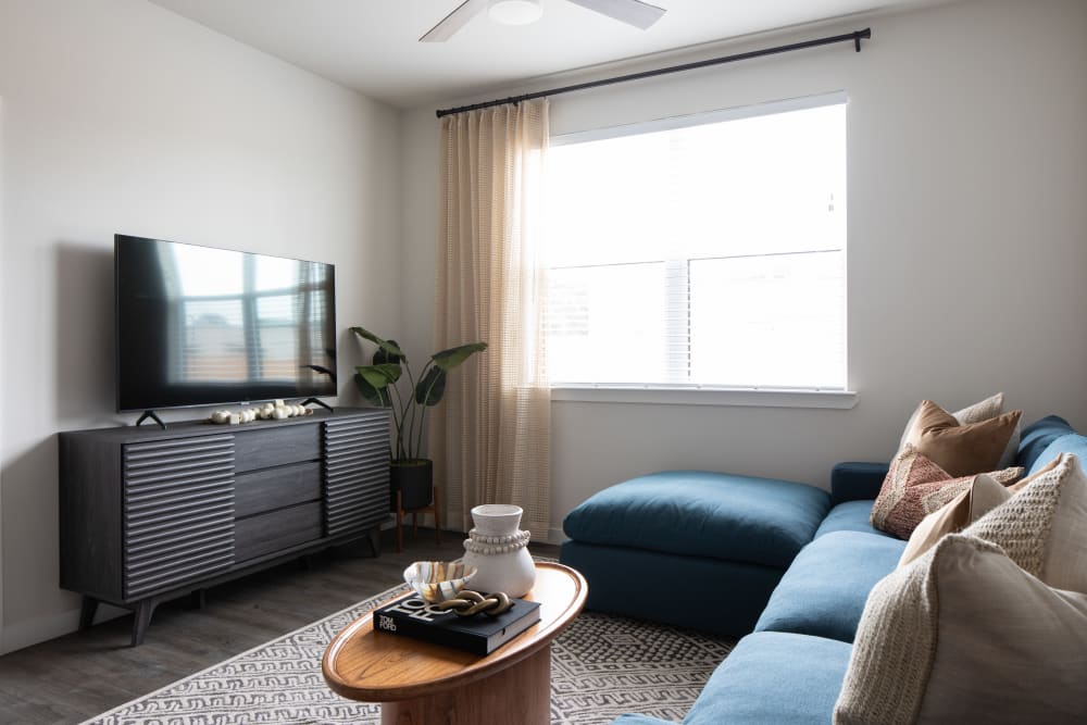 Living room with large window at Bellrock Memorial in Houston, Texas