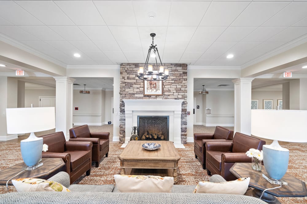 Beautiful lounge room with a fireplace at Worthington Manor in Conroe, Texas