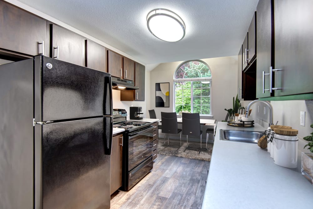 An updated kitchen with stylish cabinetry at Wellington Apartment Homes in Silverdale, Washington