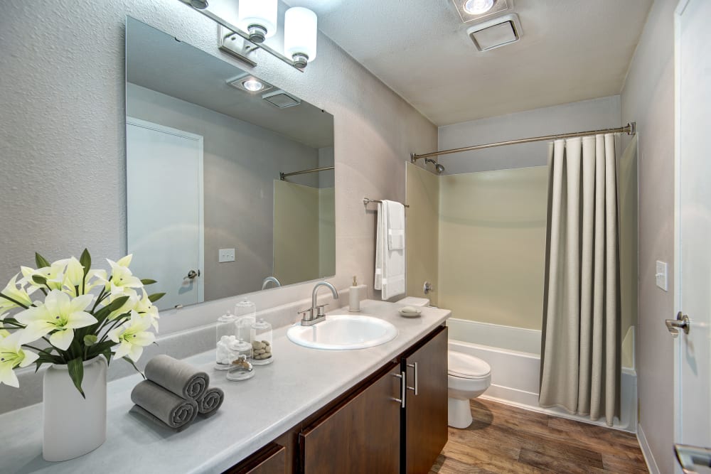 A bright and stylish bathroom at Wellington Apartment Homes in Silverdale, Washington