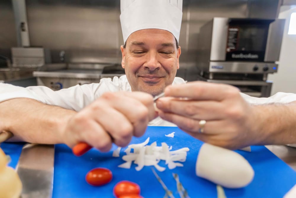 Chef preparing food at The Princeton Senior Living in Lee's Summit, Missouri