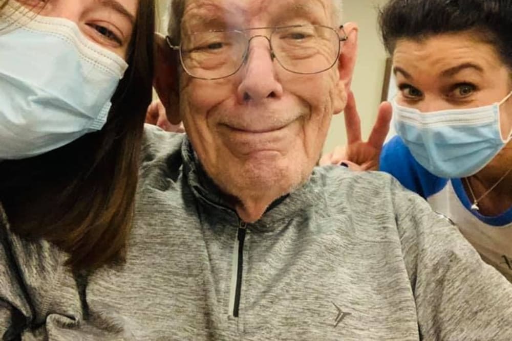 Residents and caretakers smiling at The Princeton Senior Living in Lee's Summit, Missouri