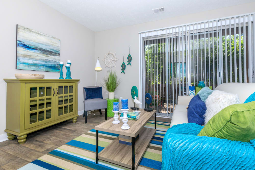 Model living room opening onto a private patio at The Boardwalk at Westlake in Indianapolis, Indiana