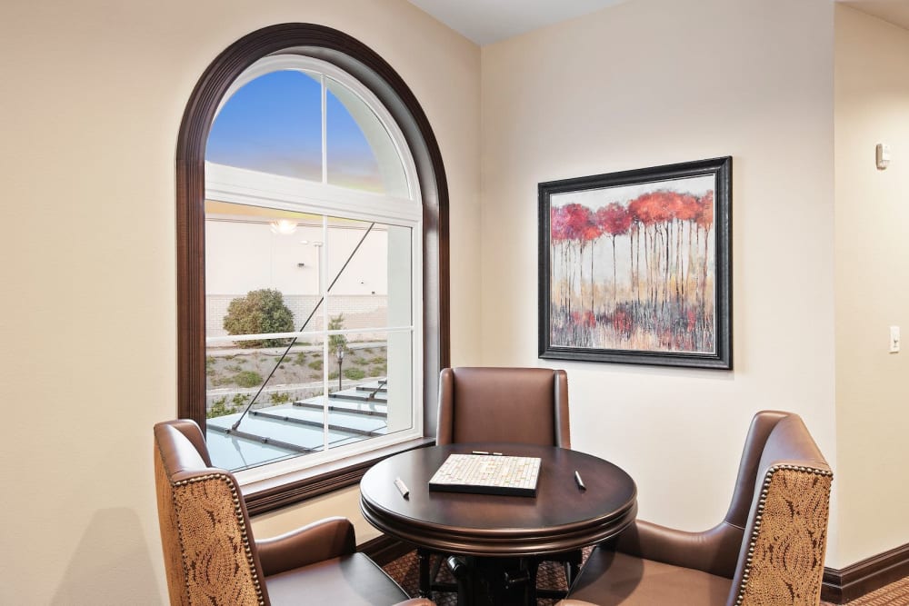 Seating area next to a window at Pacifica Senior Living Oceanside in Oceanside, California