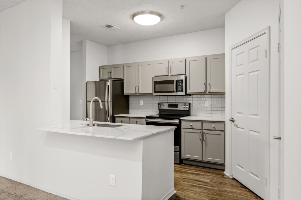 Kitchen with modern finishes at Greenwood Plaza in Centennial, Colorado