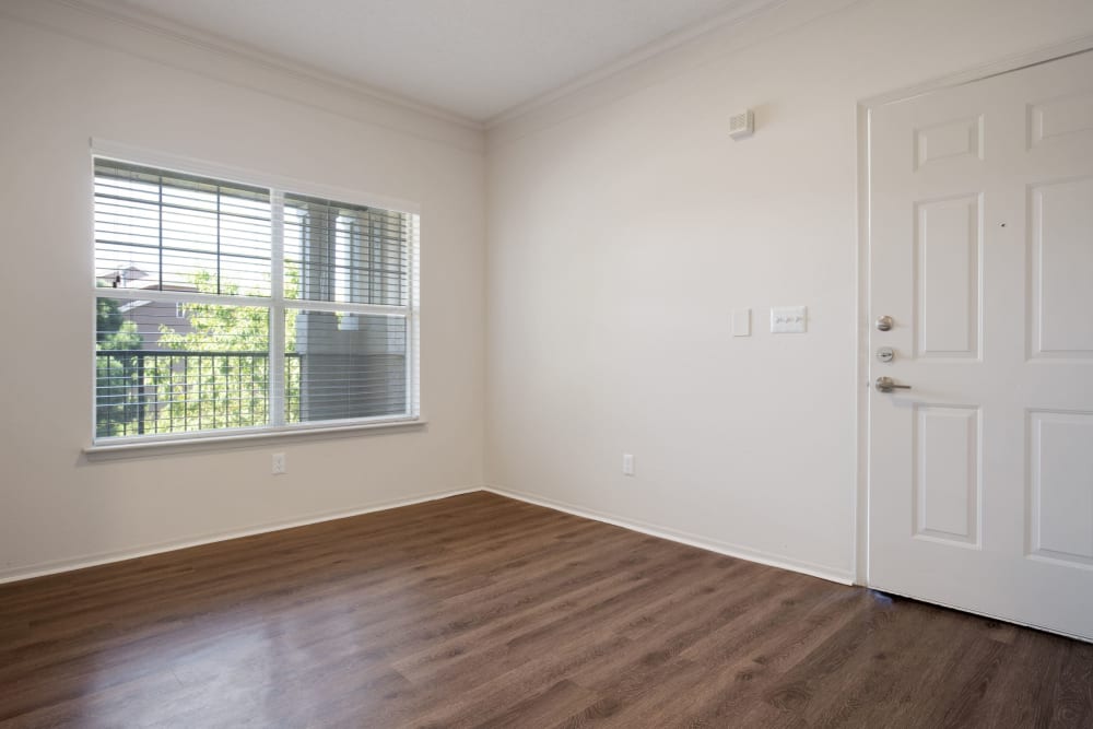 A bright and open living room with Wood-Style flooring at Greenwood Plaza in Centennial, Colorado