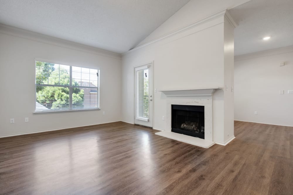 Living room with fireplace and Wood-Style flooring at Greenwood Plaza in Centennial, Colorado