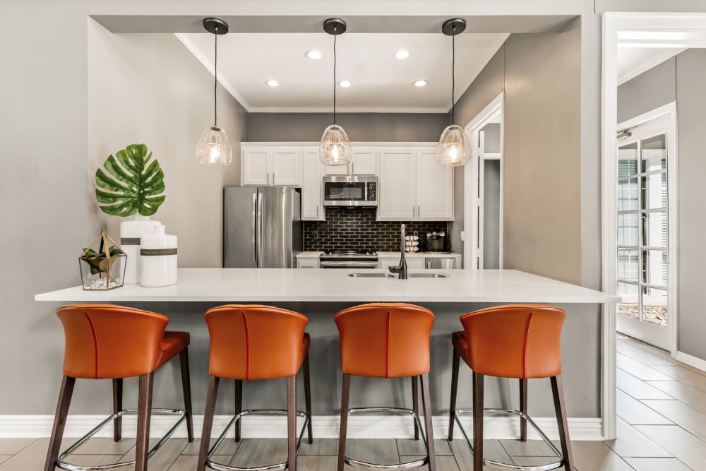 Clubhouse kitchen area with seating at Greenwood Plaza in Centennial, Colorado