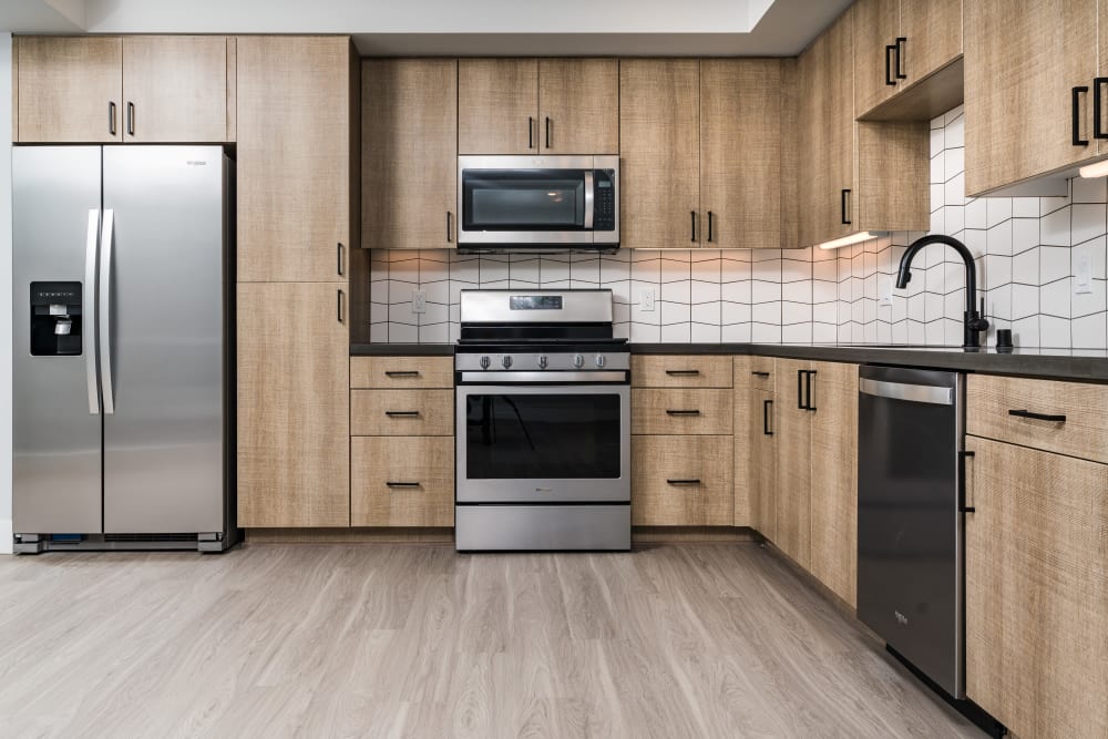 Kitchen with stainless steel appliances at The Alamitos in Long Beach, California