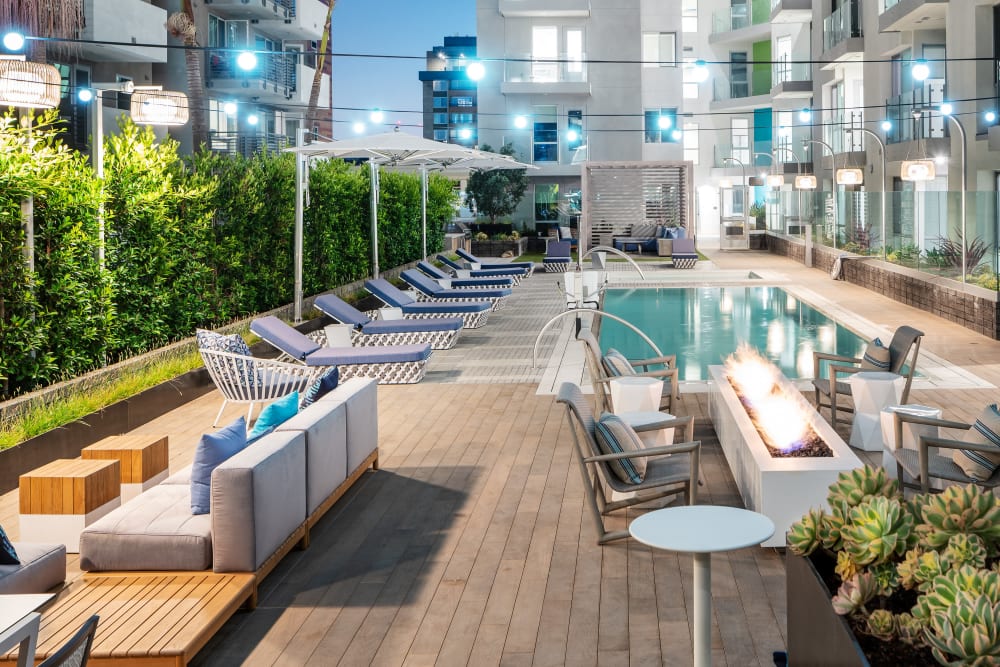Pool and lounge seating with fire pit at The Pacific in Long Beach, California