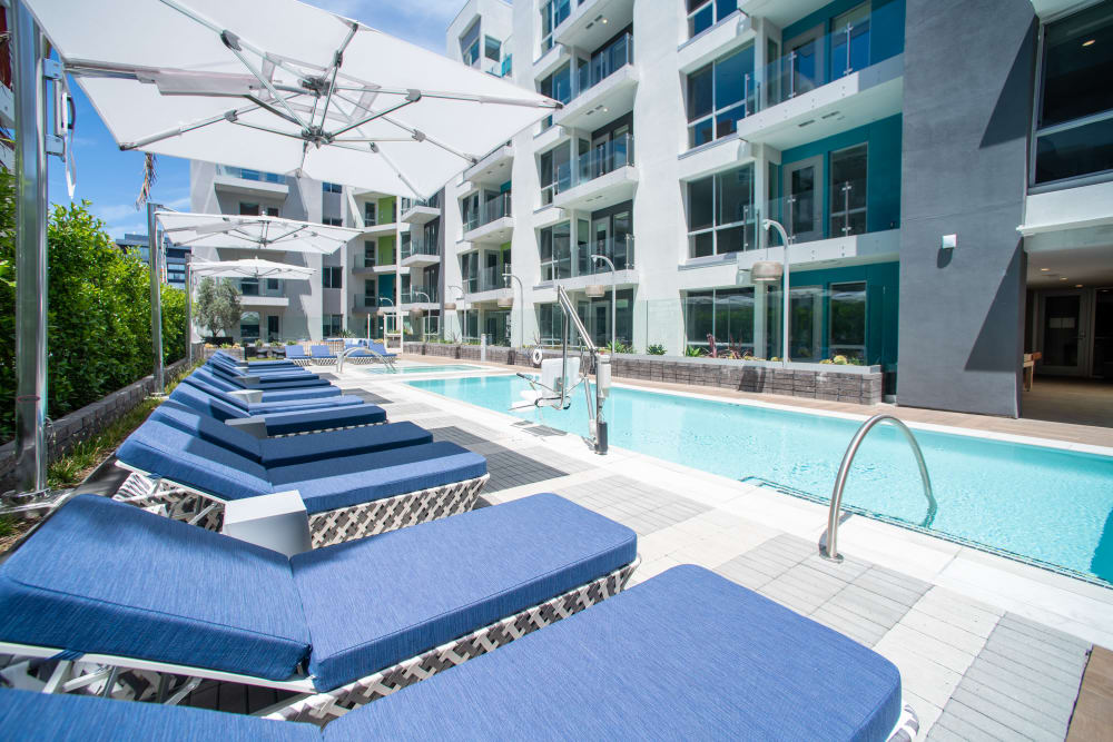 Chaise lounges by the pool at The Pacific in Long Beach, California