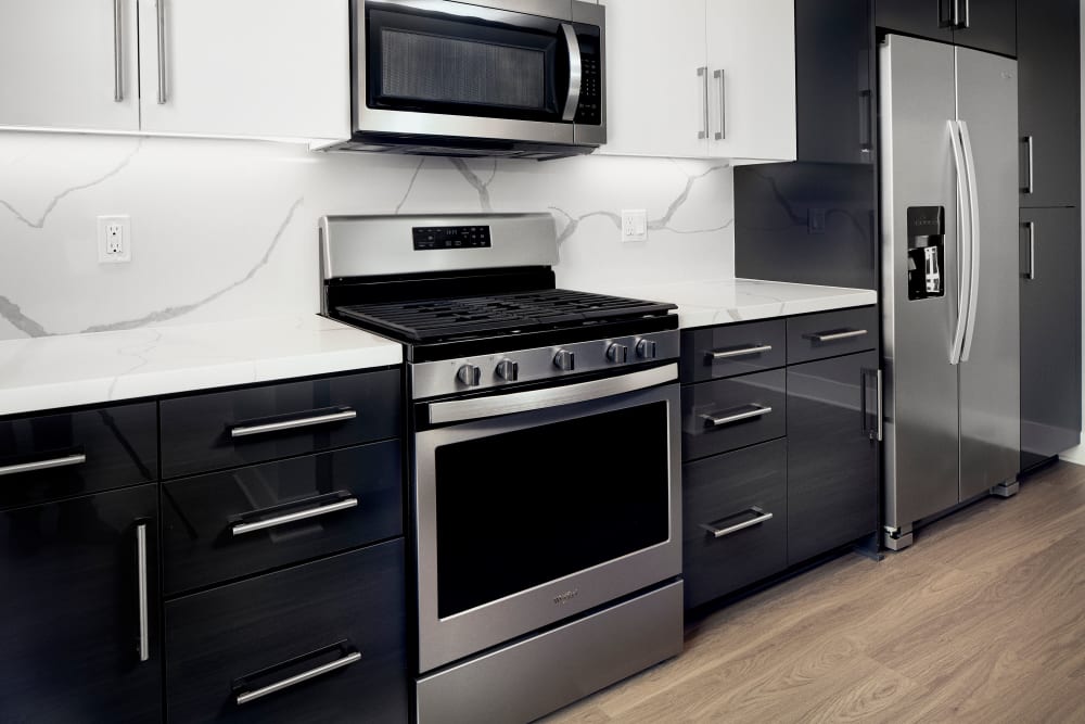 Kitchen with stainless steel appliances at The Linden in Long Beach, California