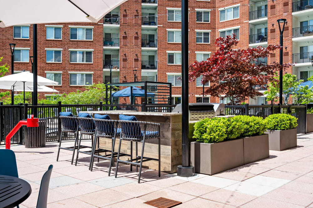 Exterior courtyard lit up with seating area Sofi at 50 Forest in Stamford, Connecticut