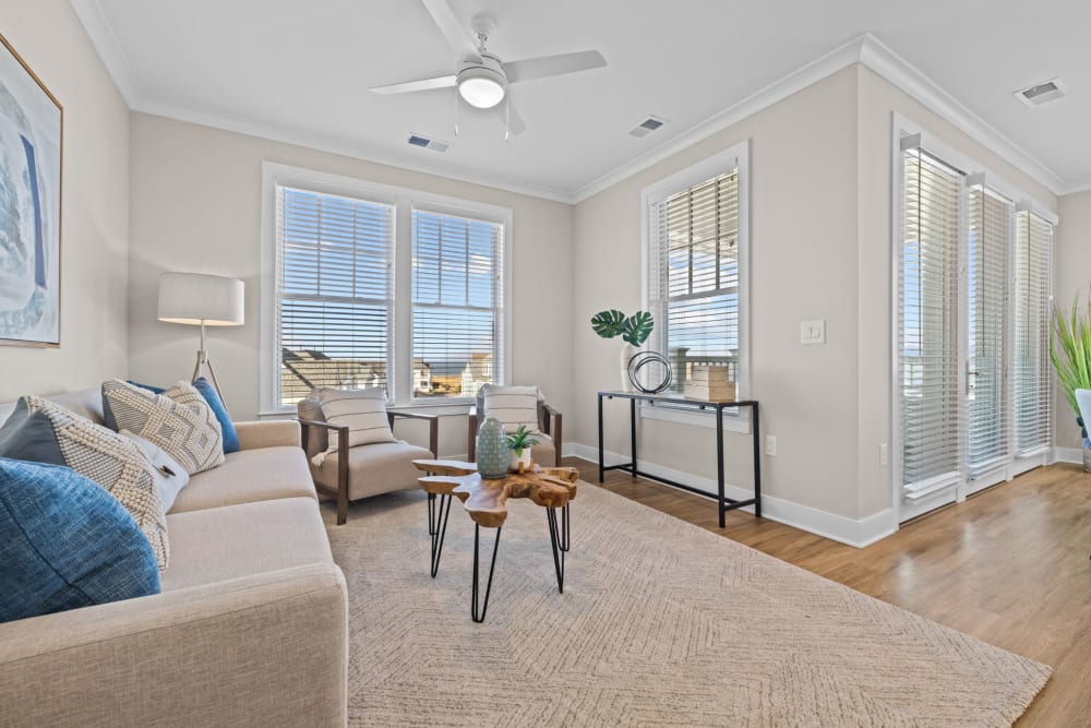 Spacious living room at Village Square Apartments in Norfolk, Virginia