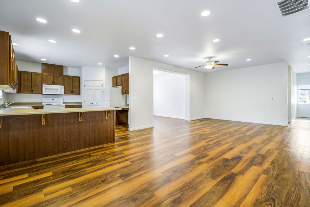 Wood flooring in an apartment dining room and kitchen at Meriwether Landing in Joint Base Lewis McChord, Washington