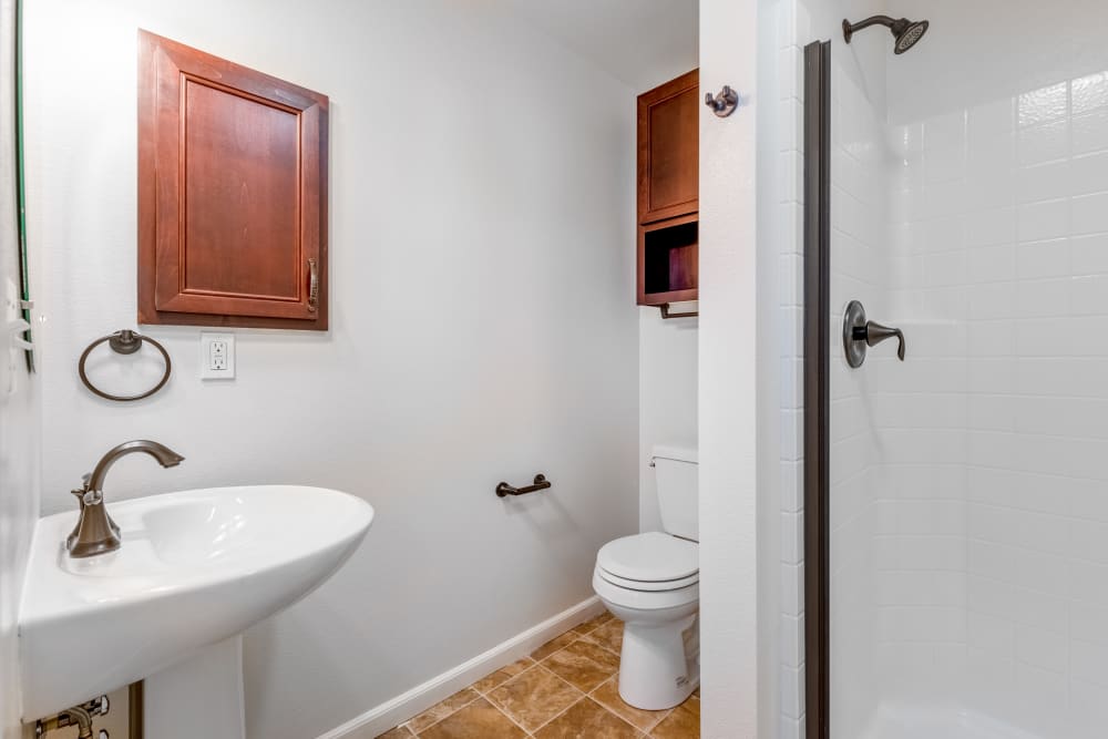 An apartment bathroom attached to a bedroom at Meriwether Landing in Joint Base Lewis McChord, Washington