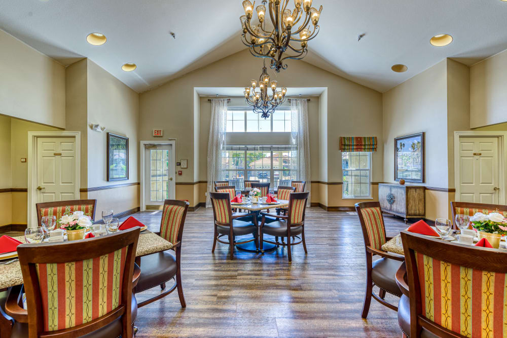 Tables and seating in the dining area at Pacifica Senior Living Hemet in Hemet, California