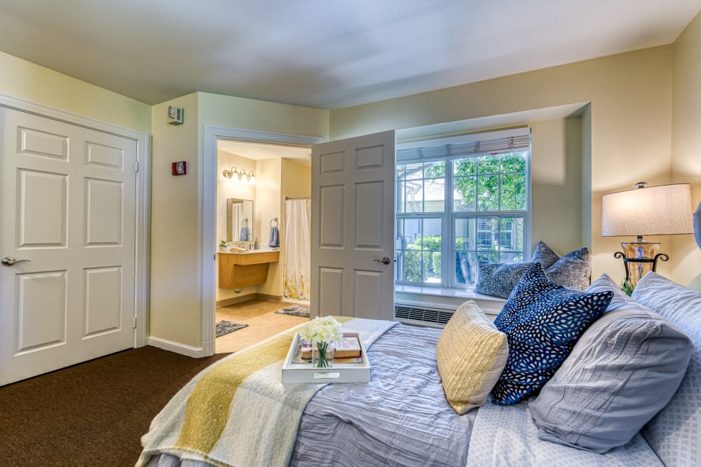 Bed and bathroom in a residence at Pacifica Senior Living Hemet in Hemet, California