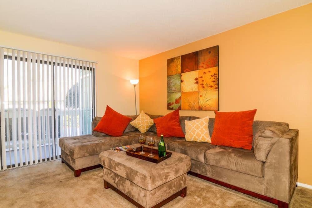 Living room with door to patio at Devonwood Apartment Homes in Charlotte, North Carolina