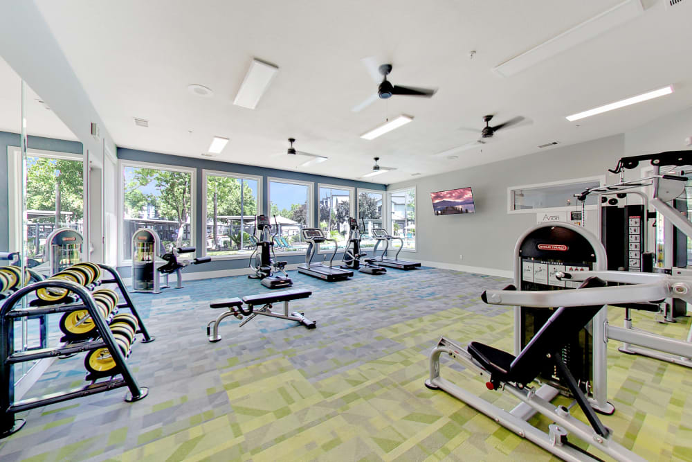 Large bedroom with a ceiling fan at Avion Apartments in Rancho Cordova, California