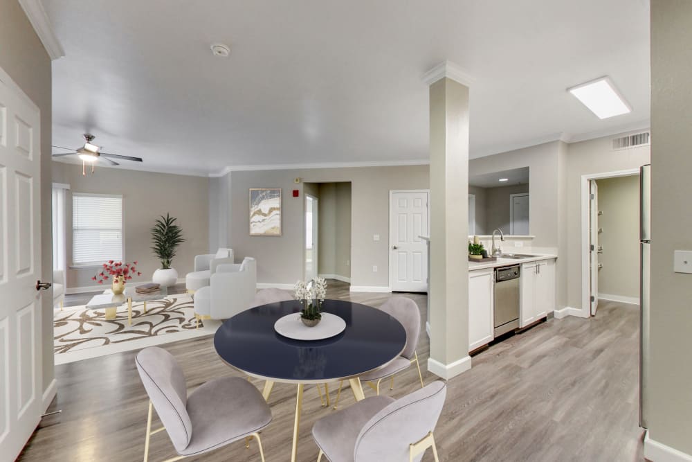 Dining room table and kitchen at Avion Apartments in Rancho Cordova, California