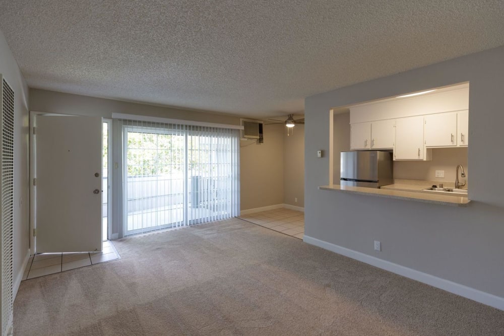Living room with access to patio at Catalina Crest Apartment Homes in Livermore, California