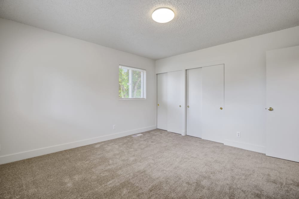 A bedroom with ample closet space in a townhome at Clarkdale in Joint Base Lewis McChord, Washington
