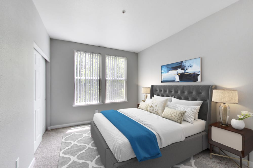 Spacious bedroom with carpeting at Natomas Park Apartments in Sacramento, California