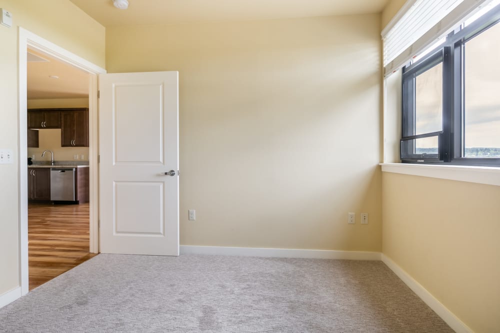 Spacious bedroom with large windows for ample natural light at The Meridian in Salem, Oregon
