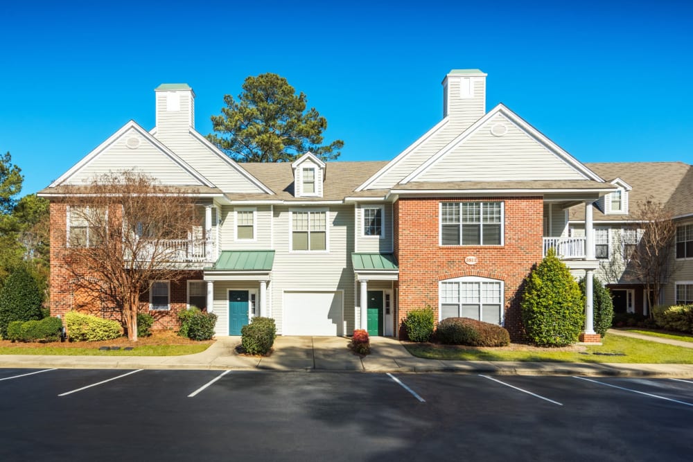 Exterior and resident parking at The Preserve at Grande Oaks in Fayetteville, North Carolina
